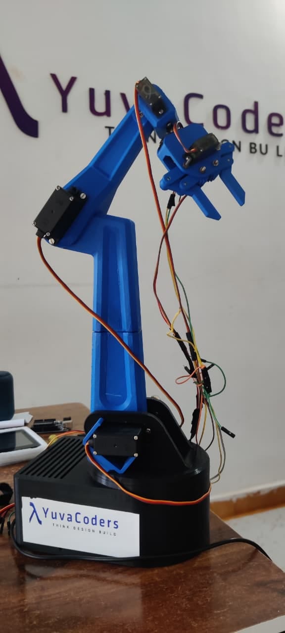A 3D-printed robotic arm with a gripper built by YuvaCoders students
